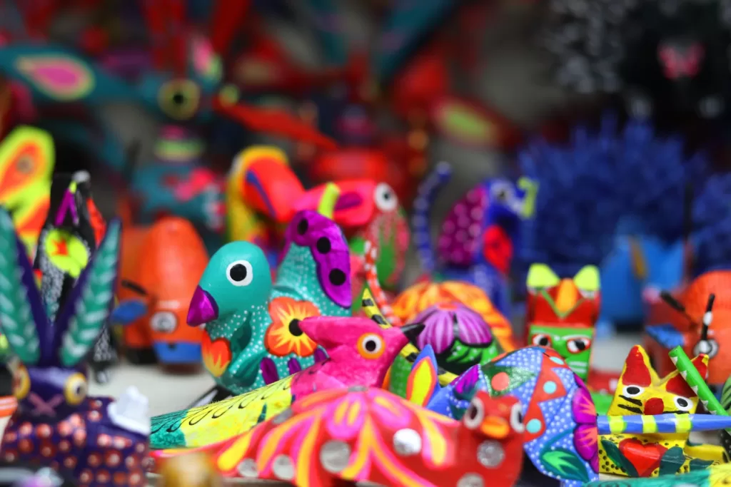 multicolored bird toys lot Oaxaca market