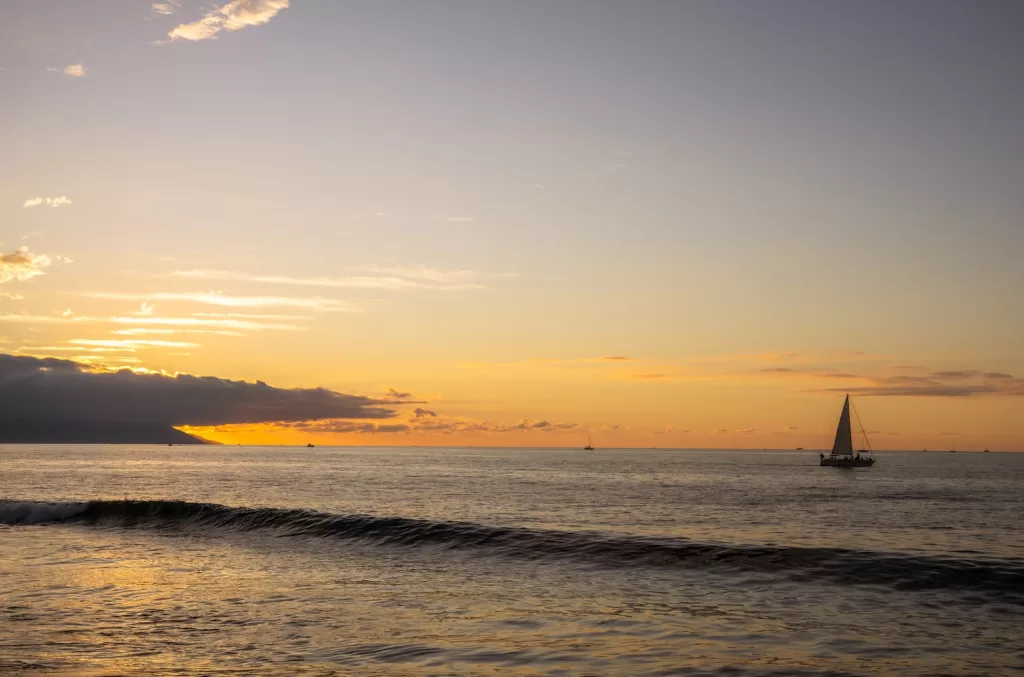 Sailboat on the Ocean during Sunset 