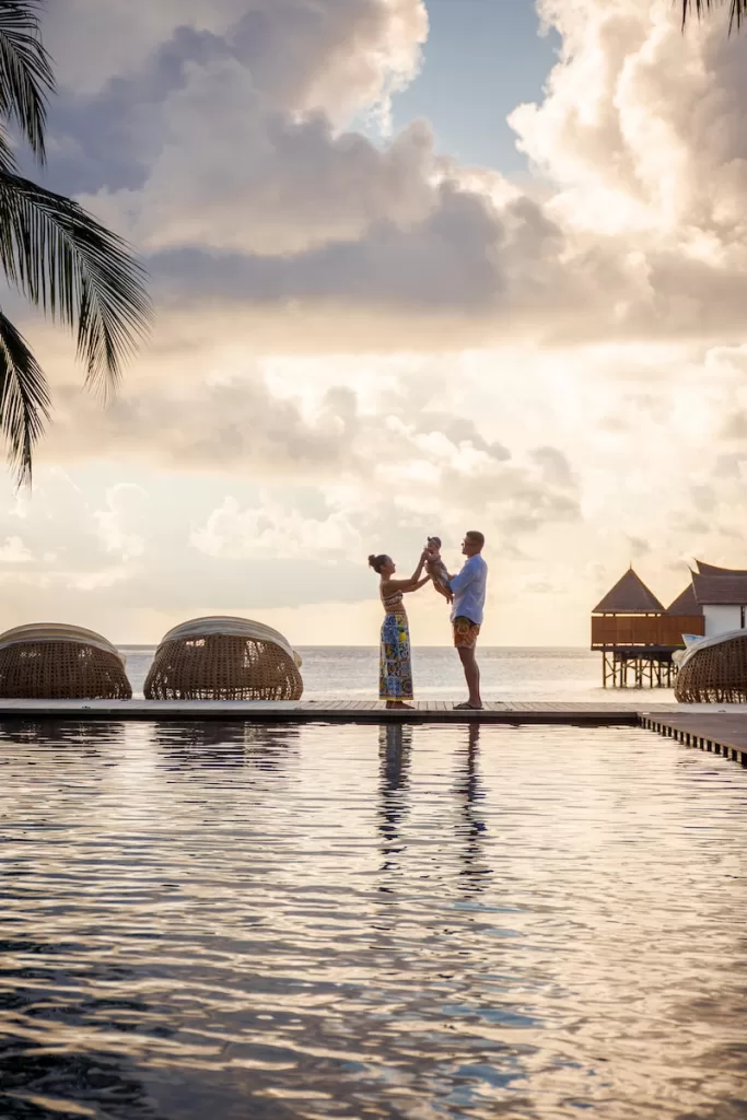 couple kissing on the beach during sunset Is Acapulco Safe to Travel for Families