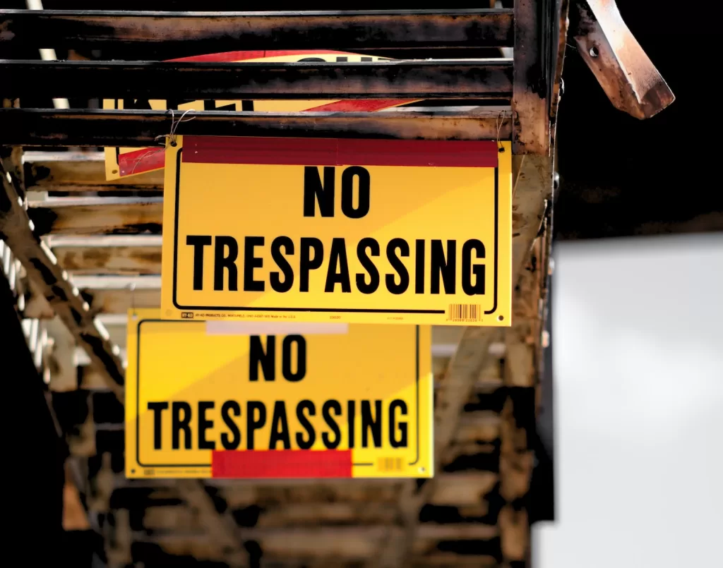 No Trespassing sticker on brown surface. Areas to Avoid in Acapulco: Stay Informed