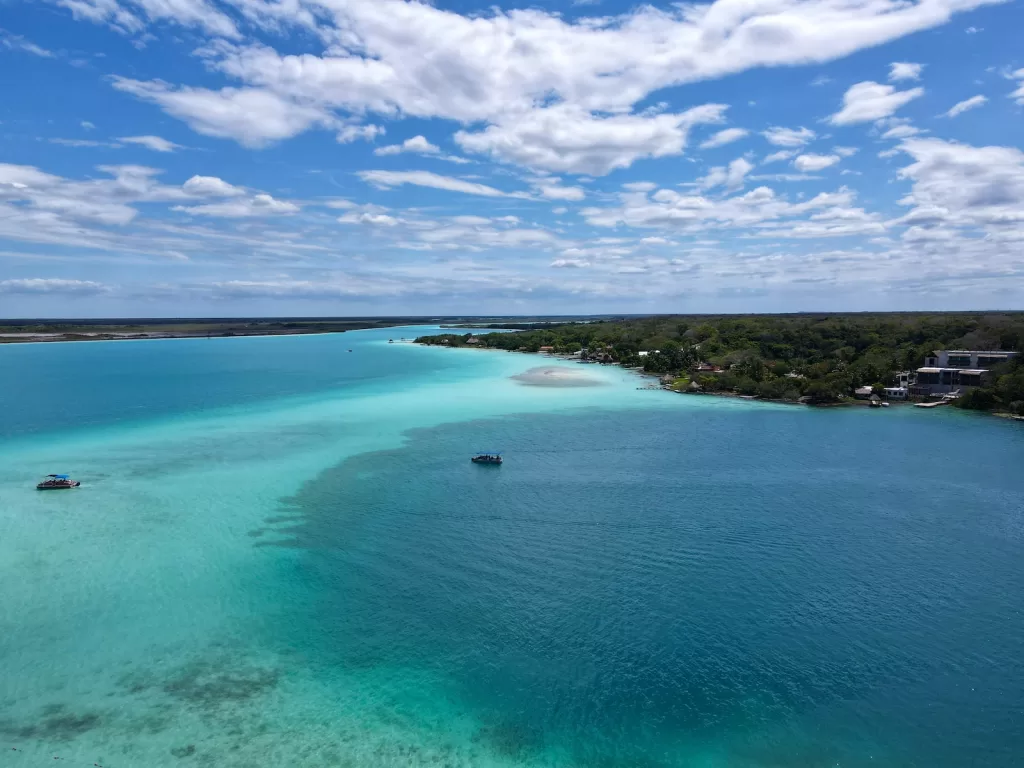 a body of water with land in the background Bacalar Lagoon