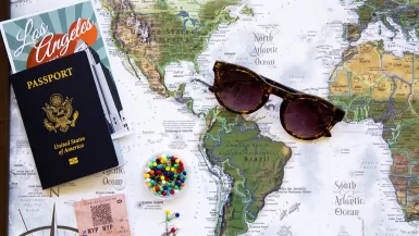 brown framed sunglasses on map of favorite destinations