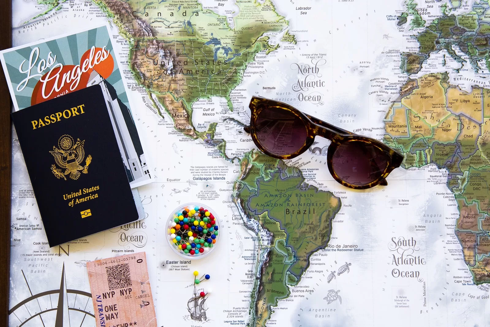 brown framed sunglasses on map of favorite destinations