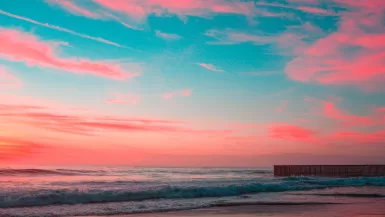 body of water under pink and blue sky during golden hour Tijuana safety