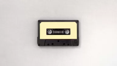 photo of black and brown cassette tape of travel songs