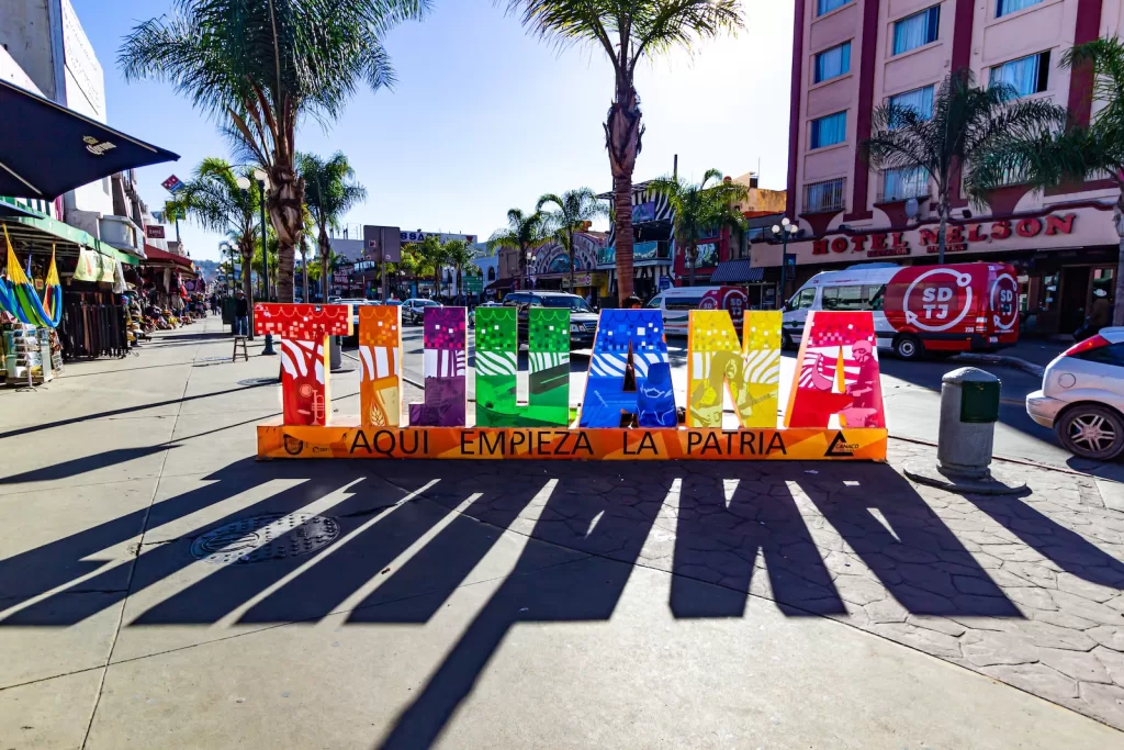 assorted colored plastic bags on street during daytime Tijuana Safety