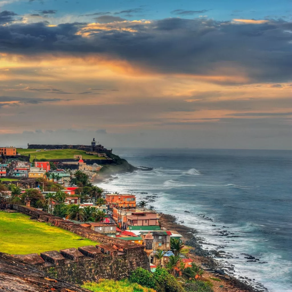 houses near sea under cloudy sky during daytime fun facts Puerto Rico