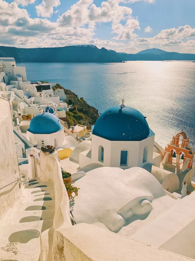 white and blue concrete building near body of water during daytime and a favorite destination