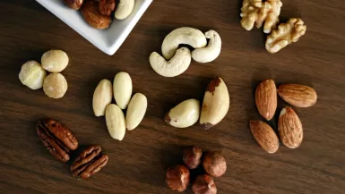 Variety of Brown Nuts on Brown Wooden Panel High-angle Photo Almond Tequila