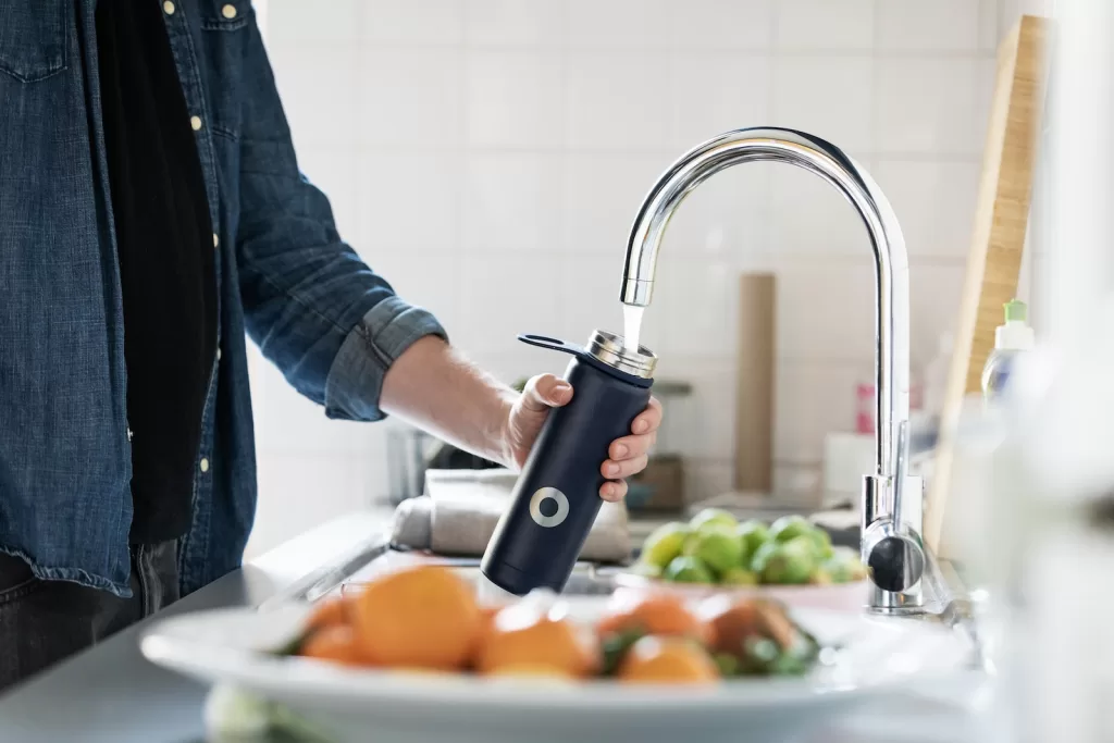 person holding stainless steel faucet in mexico and Mexico Travel Tips