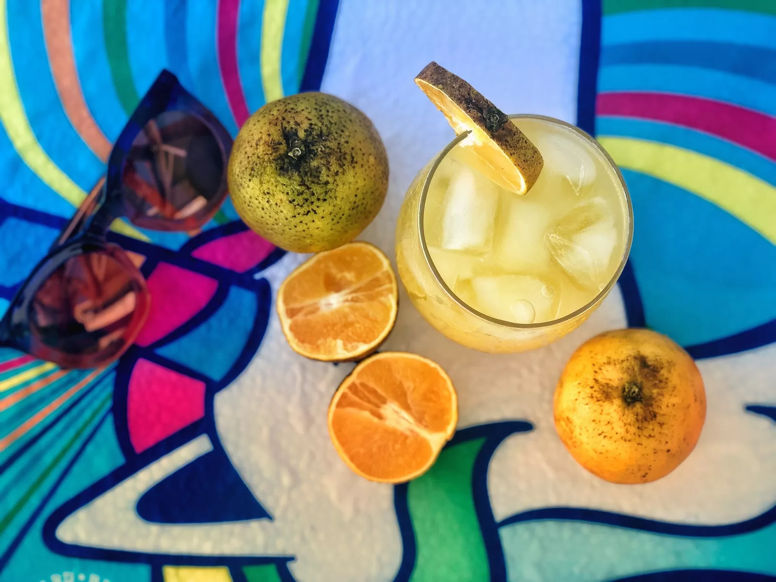 sliced lemon beside clear drinking glass mezcal vs tequila