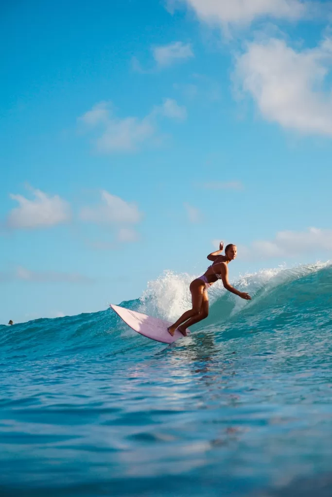 man in black shorts surfing on sea during daytime Acapulco, Guerrero the best surf spots in mexico