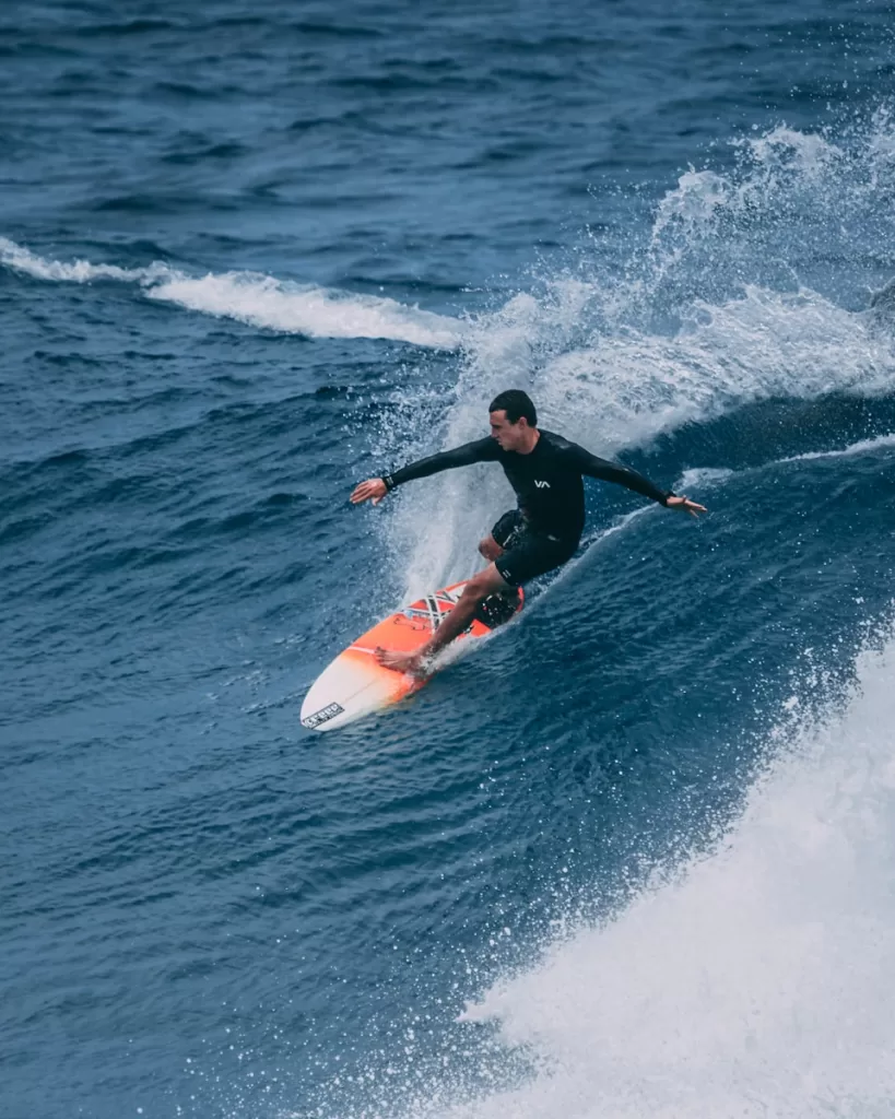 man surfing on sea waves mexico Punta Mita