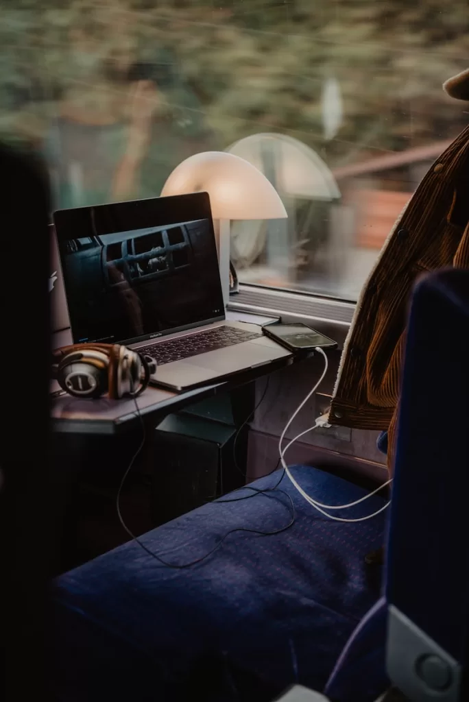 black and silver laptop computer on white table in the paris to nice train