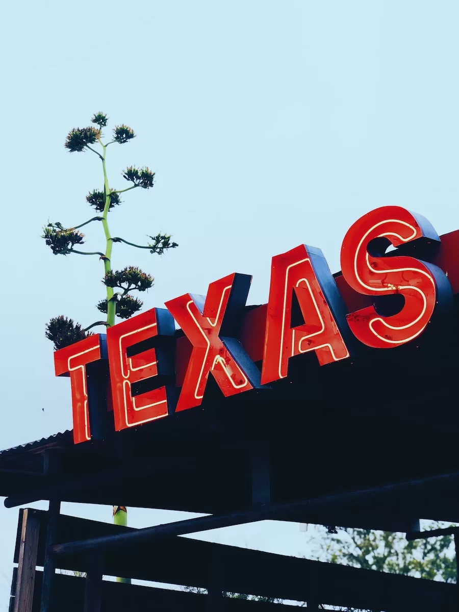 red Texas store signage Pros and Cons of Living in Texas