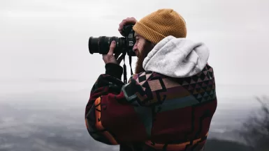 In the mountains man holds the best travel camera