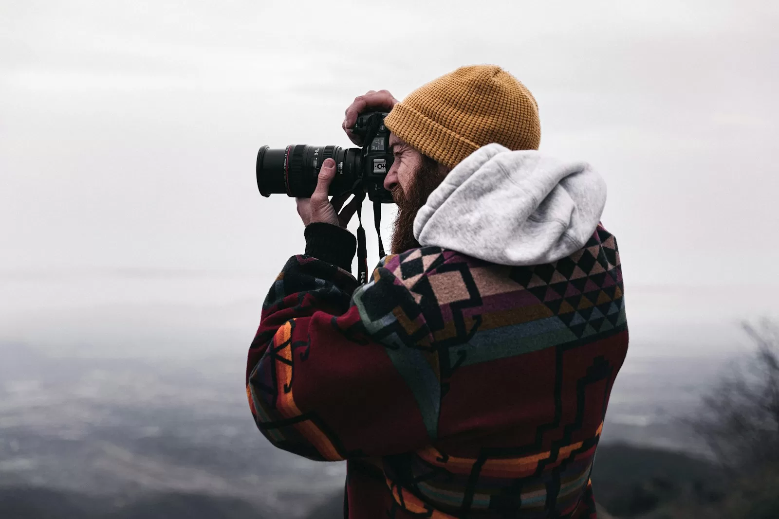 In the mountains man holds the best travel camera