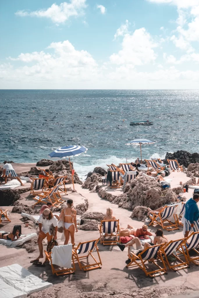 people standing near beach line in spring on the Mediterranean