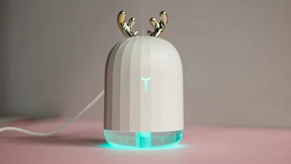 an electronic device with two birds on top of it Travel Humidifiers