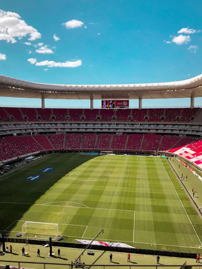 green and brown football stadium under blue sky during daytime in Zapopan