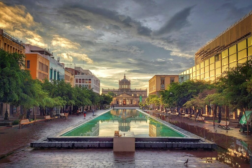 a city square with a fountain in the middle of it Guadalajara