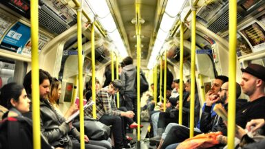 photo of group on people sitting inside train Transportation