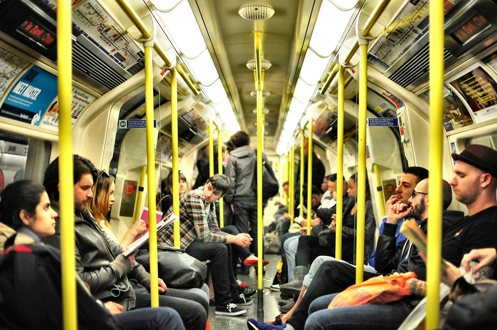 photo of group on people sitting inside train Transportation