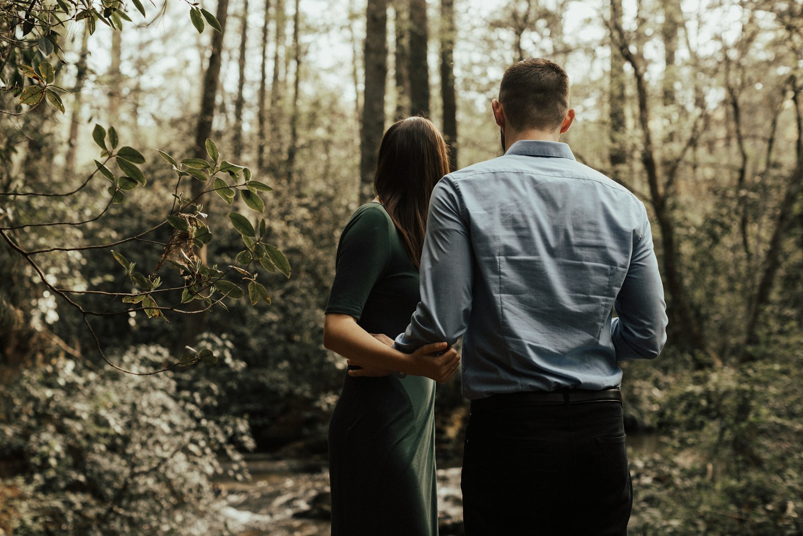 man and woman standing inside forest Outdoor Lovers