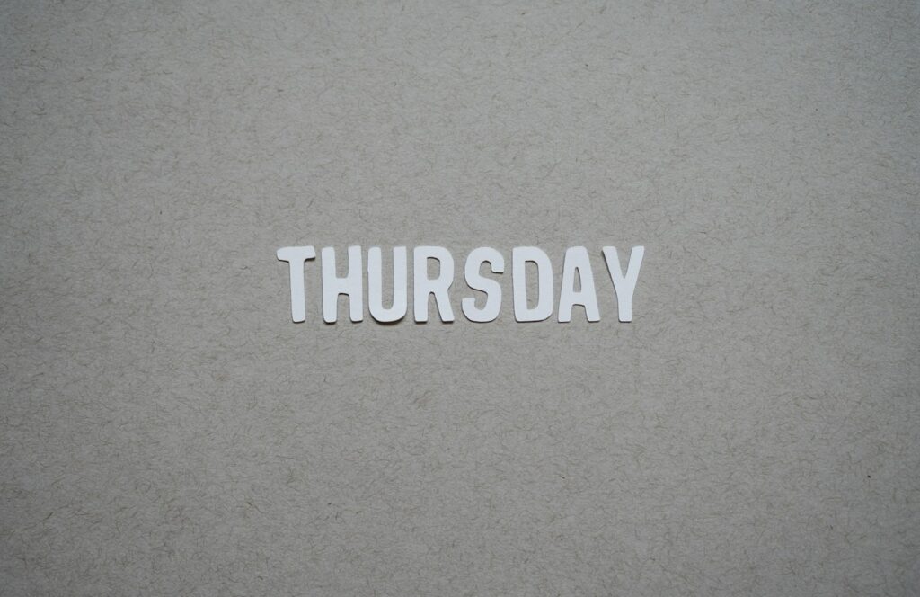 the word thursday cut out of paper